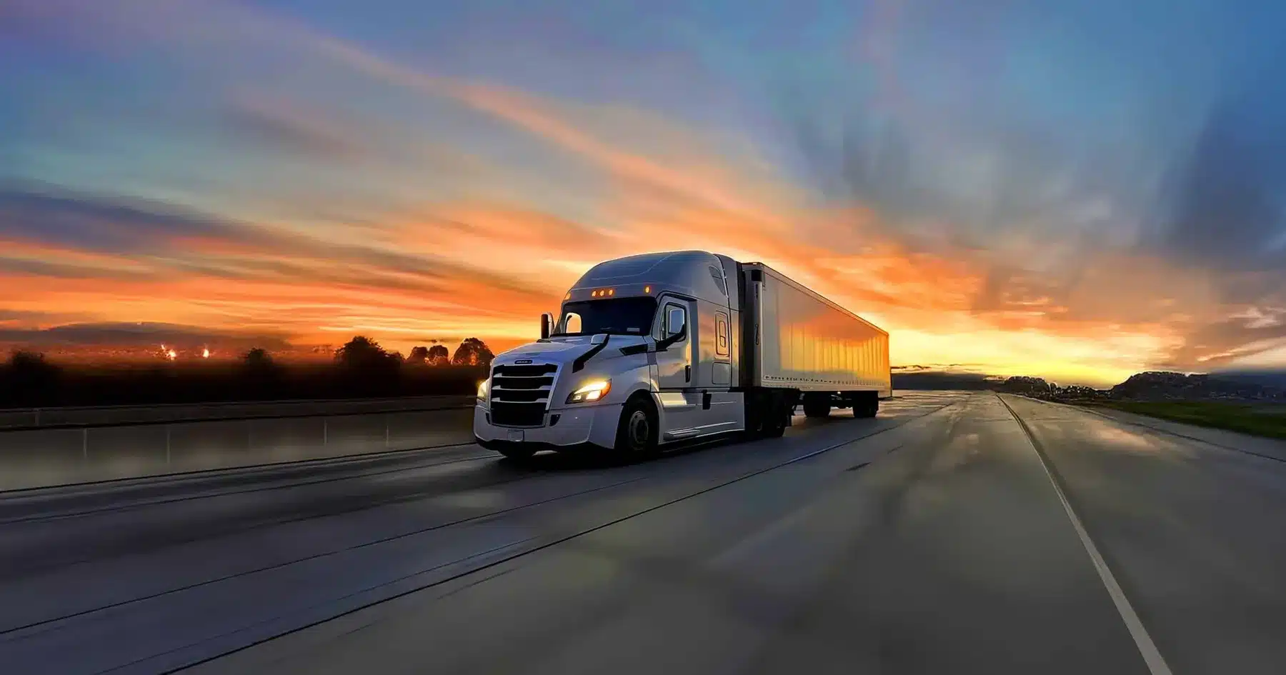Zephyr Expediting truck on the highway at sunset